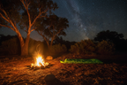 Sleeping bag by campfire